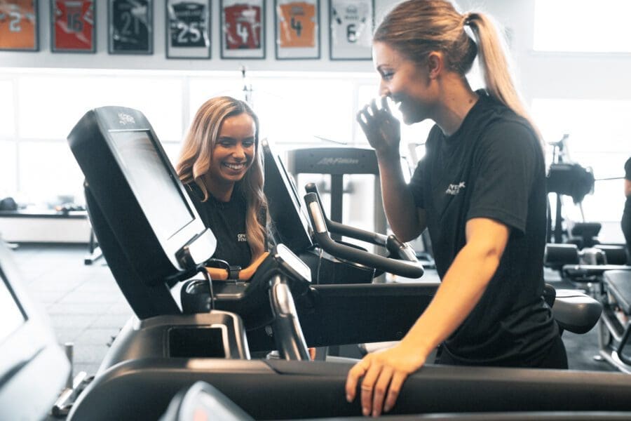Female Personal Trainer with Female Client on Treadmill Female Personal Trainer with Female Client on Treadmill