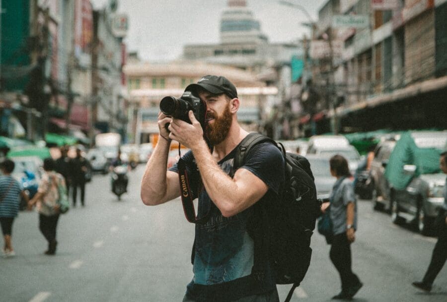 A photographer taking photographs of buildings, one of high paying jobs without a degree