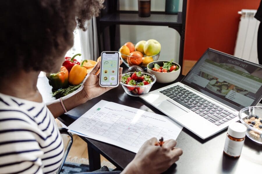 nutritionist qualifications woman doing work on laptop