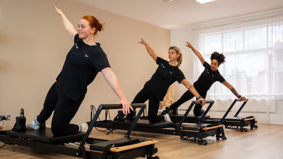 Instructor demonstrating how to use the reformer.