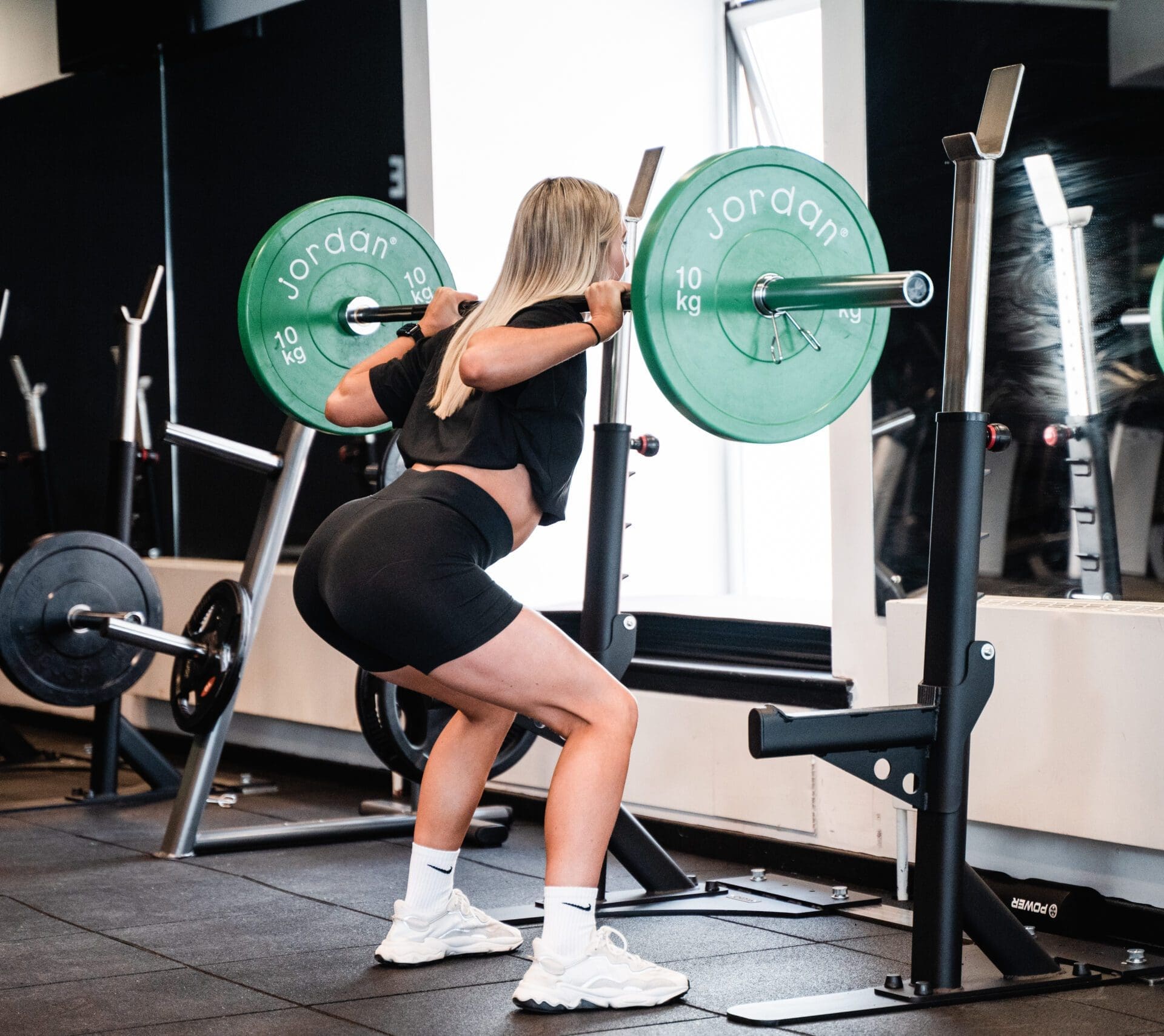 Personal Trainer student doing a squat in PT Course Romania