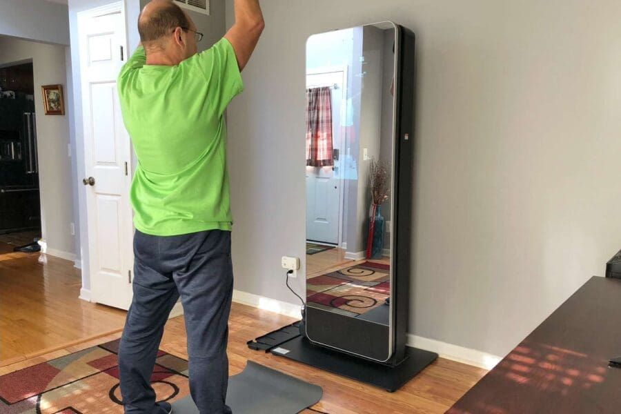 Client using a smart mirror, an ai personal trainer tool.