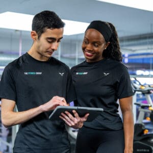 Two Personal trainers working in the gym.